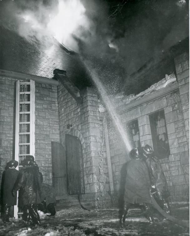 Firefighters work to put out the fire in Eaton Chapel