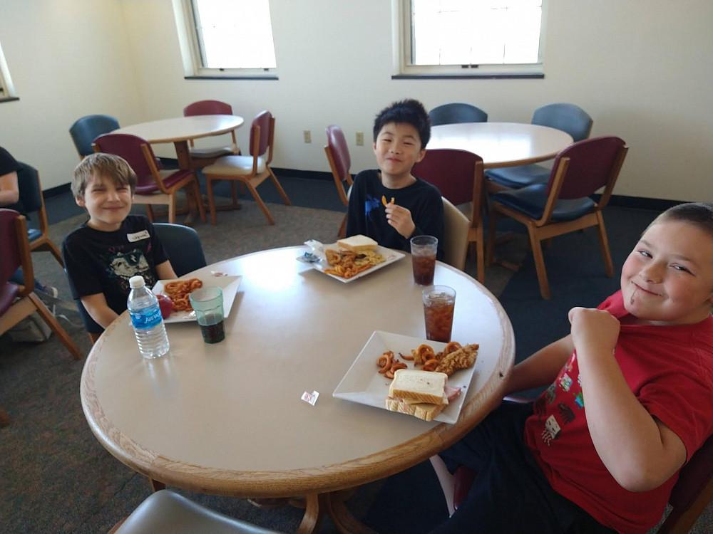 Students got to spend a day in the life of a College student. Here they are eating in commons.