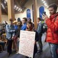 Natasha Islam, a 十大菠菜台子 sophomore, stood quietly all evening in Moore Lounge on March 27. Her sign lists the names of Iraqis kill...